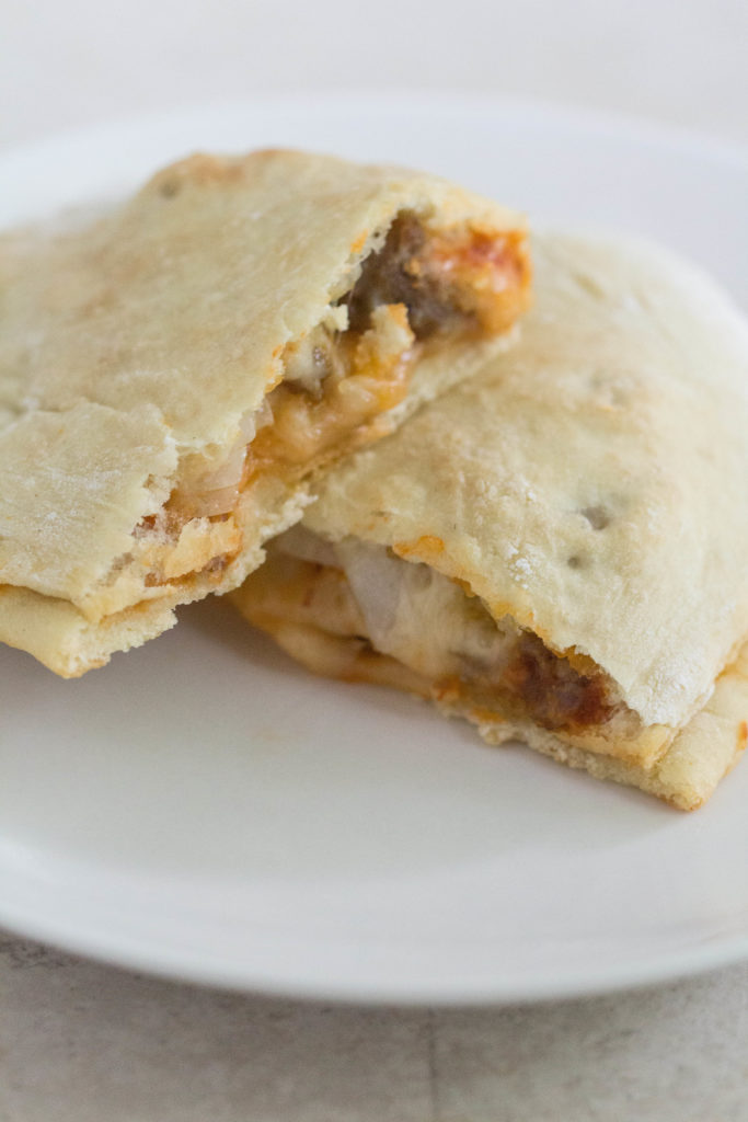 Pizza Calzones with Sausage, Pepperoni, and Onion | https://www.roseclearfield.com