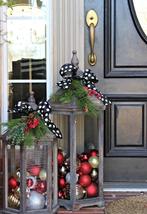 Christmas Decoration Inspiration - lanterns filled with holiday ornaments on the front porch. So cute!