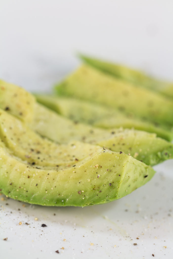 Sliced Avocado With Salt and Pepper
