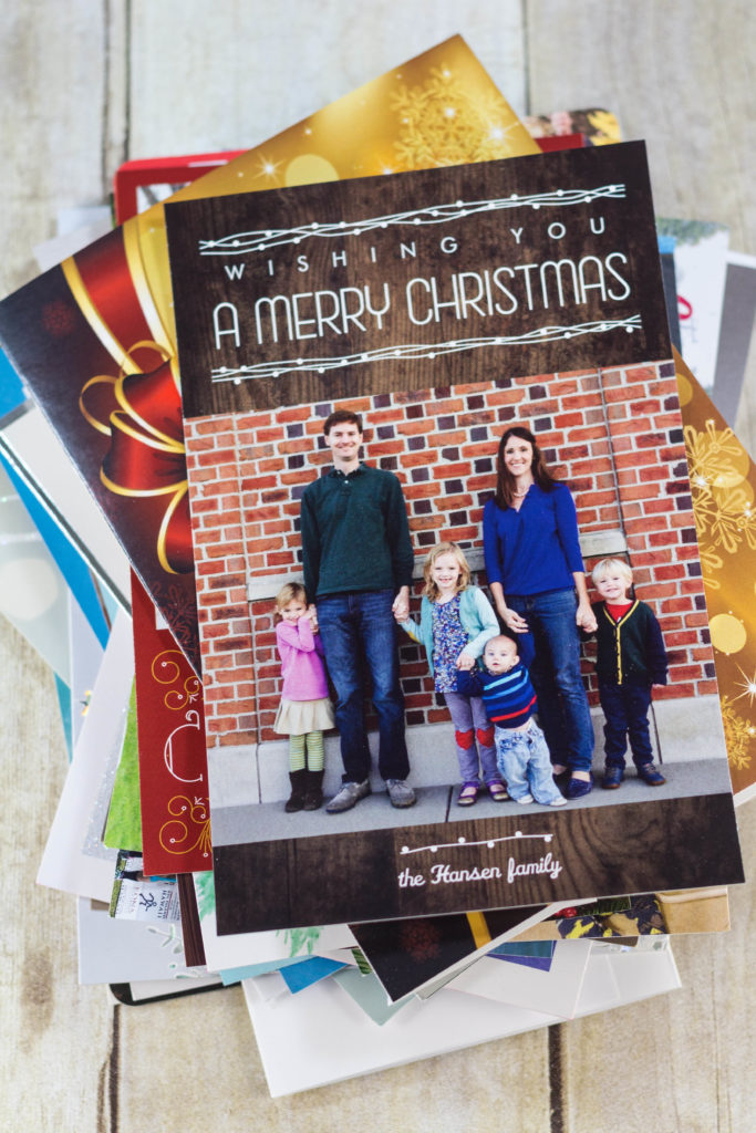 DIY Upcycled Christmas Card Books - Christmas cards, letters, and photos ready for the book.