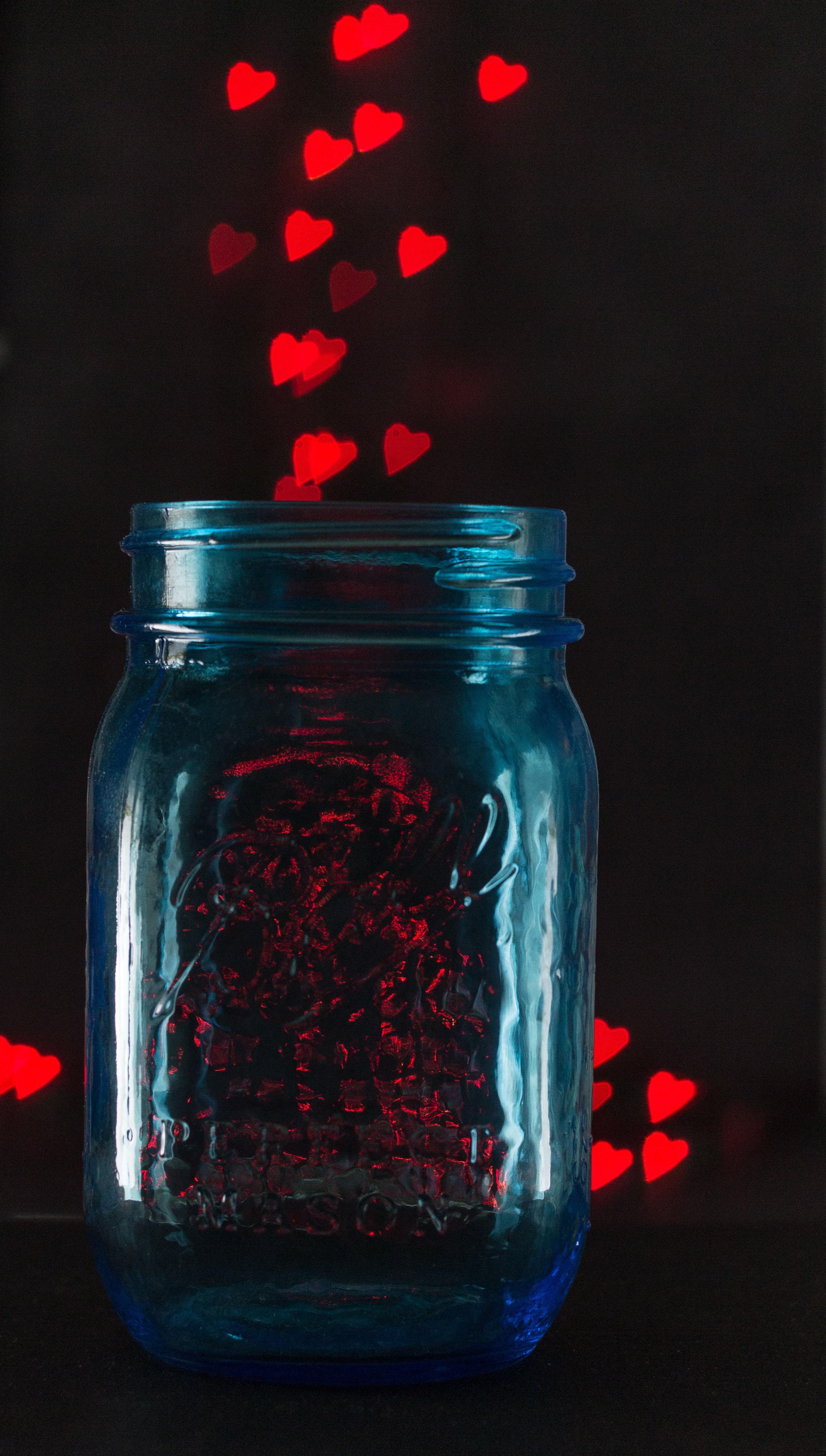 Blue Ball jar with DIY red heart bokeh. | https://www.roseclearfield.com