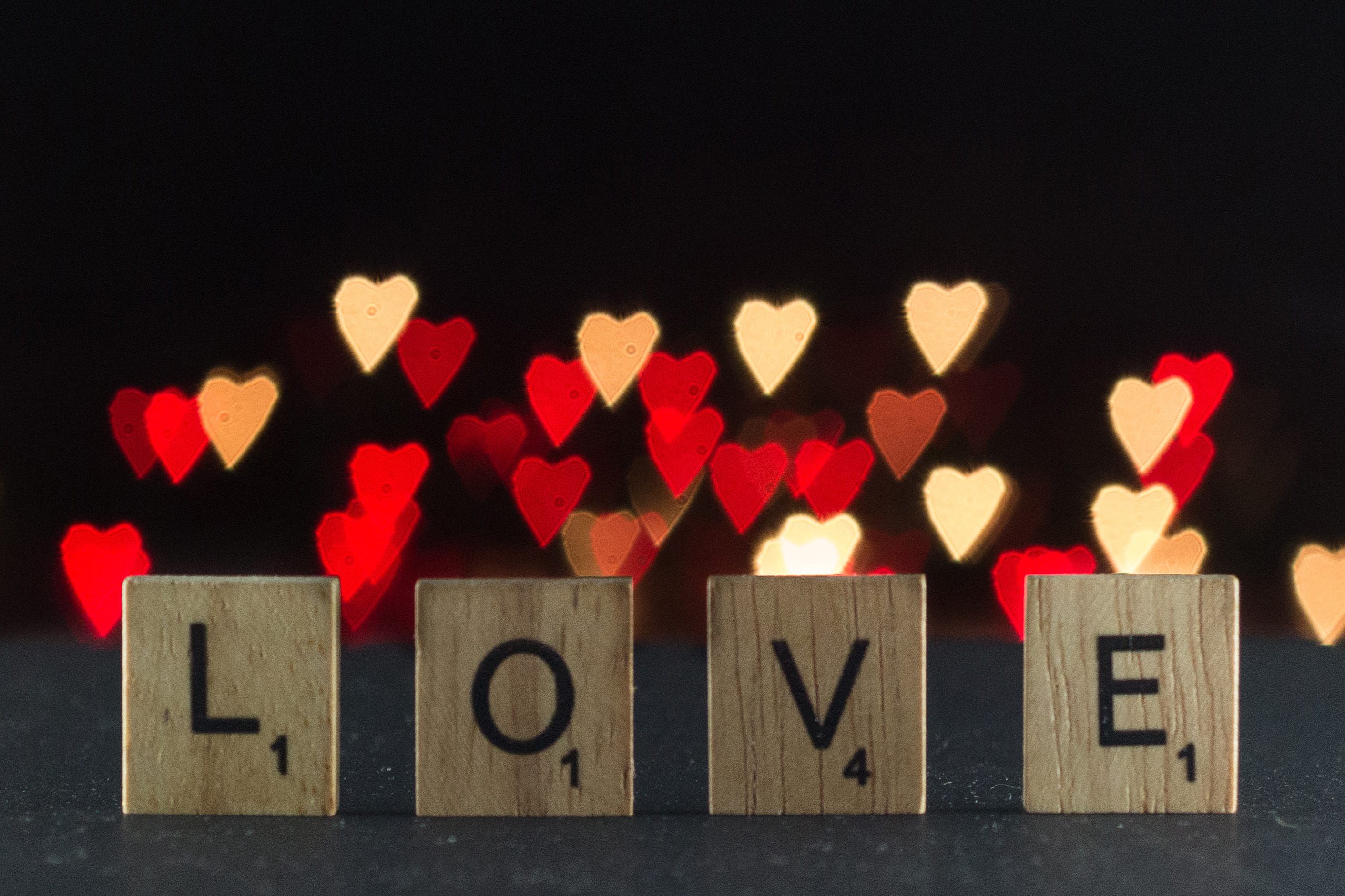 Scrabble tiles LOVE letters with DIY heart bokeh background for Valentine's Day. | https://www.roseclearfield.com