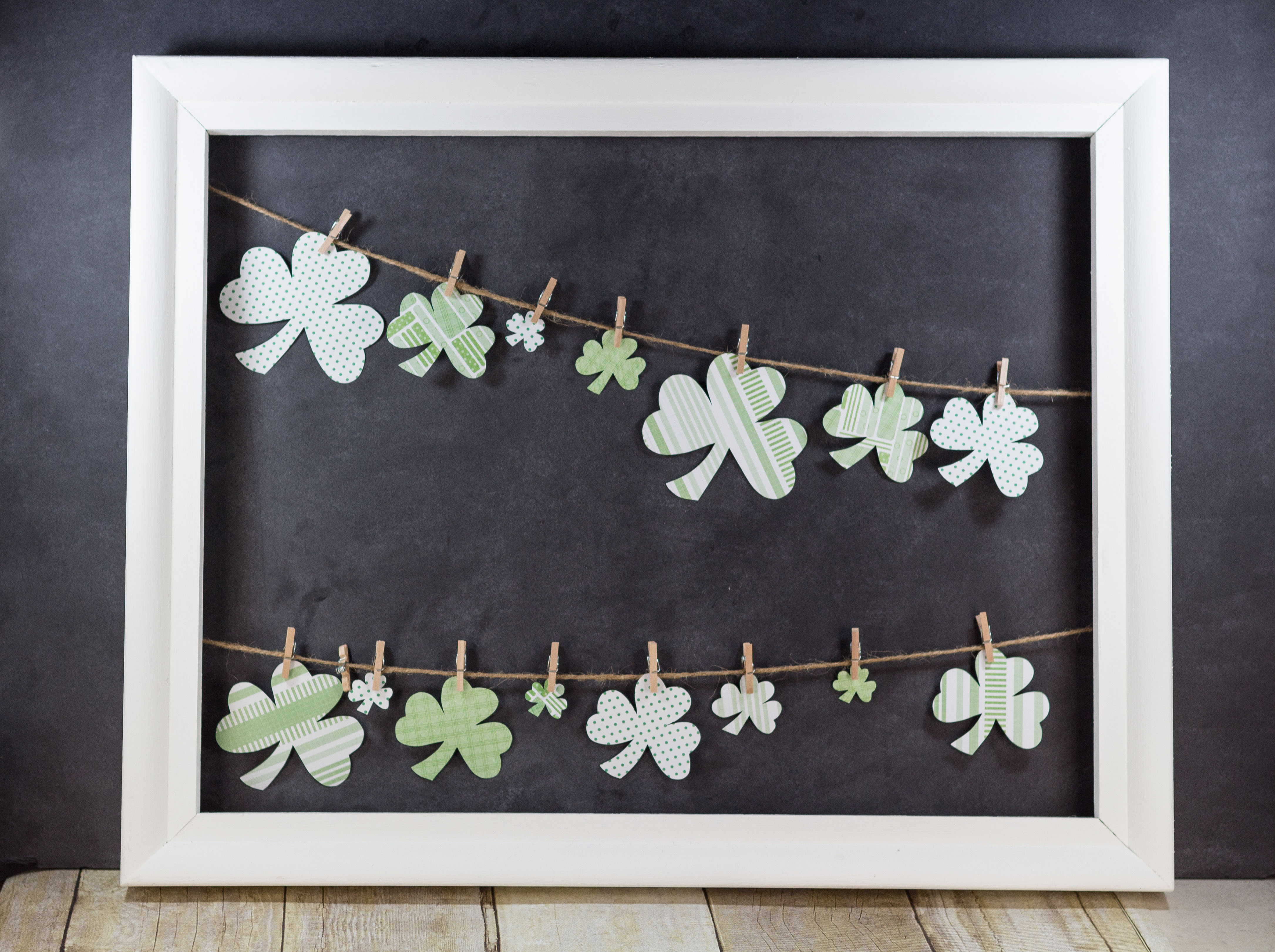 DIY St. Patrick's Day Shamrocks Hanging in Open White Frame | https://www.roseclearfield.com