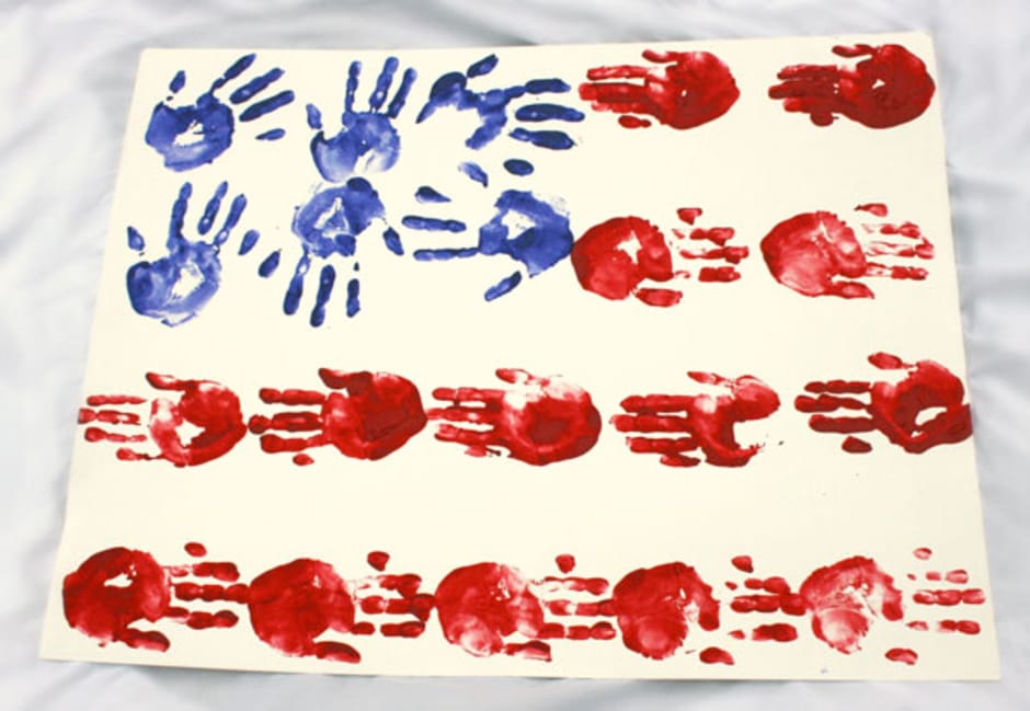 Easy DIY Fourth of July Decorations - Patriotic Handprint Flag via She Knows | https://www.roseclearfield.com