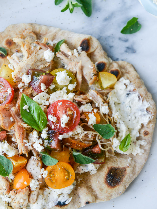 30 Days of Healthy Grilling Recipes - Smoky Grilled Chicken Pita Flatbreads with Creamy Feta via How Sweet It Is | https://www.roseclearfield.com