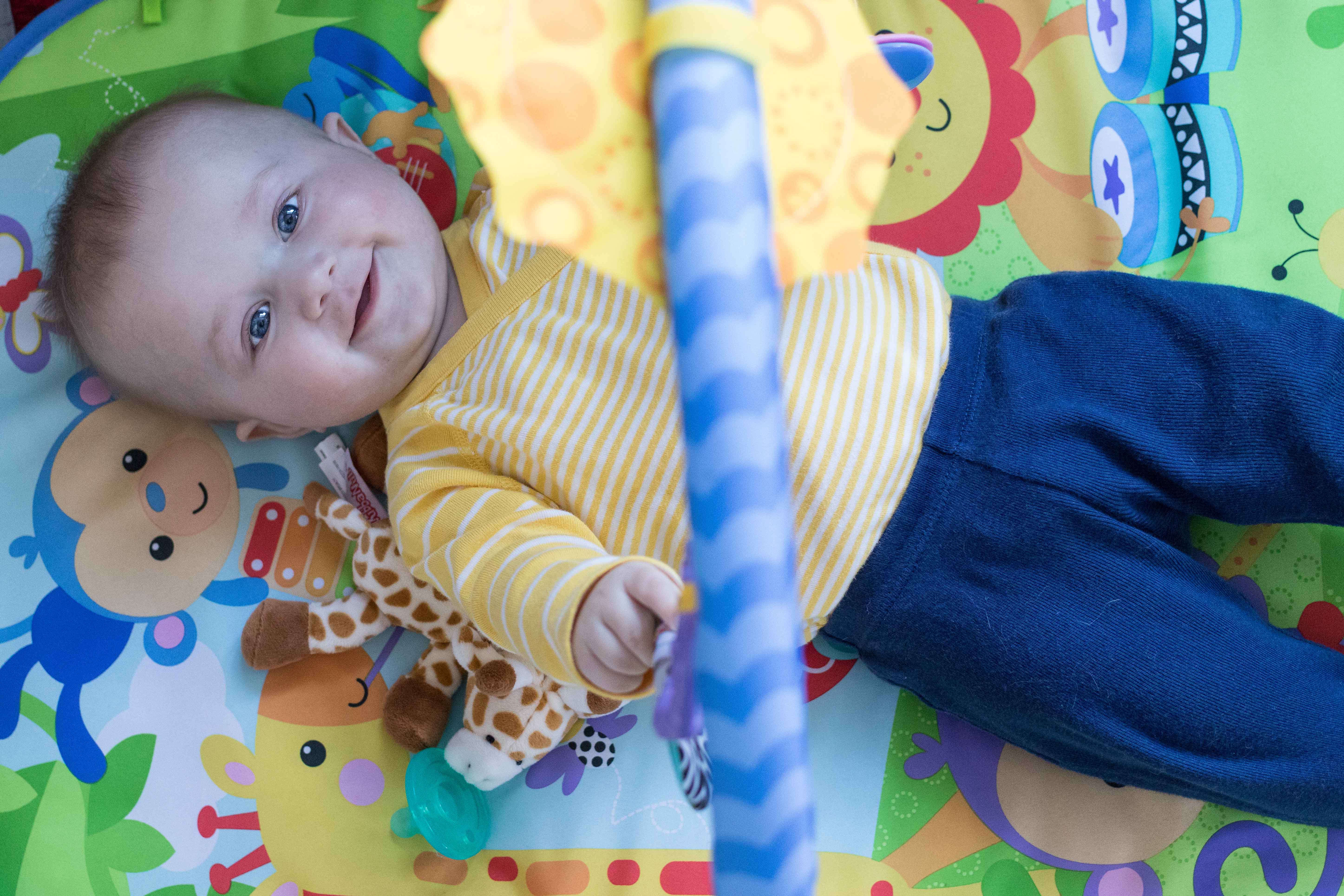 Tommy in Hanna Andersson White and Yellow Striped Onesie | https://www.roseclearfield.com