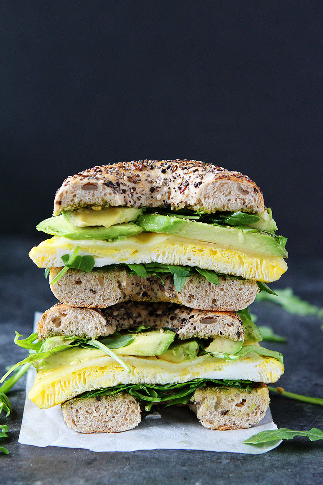 Breakfast for Dinner Ideas - Egg Avocado and Pesto Bagel Sandwich via Two Peas and Their Pod | https://www.roseclearfield.com