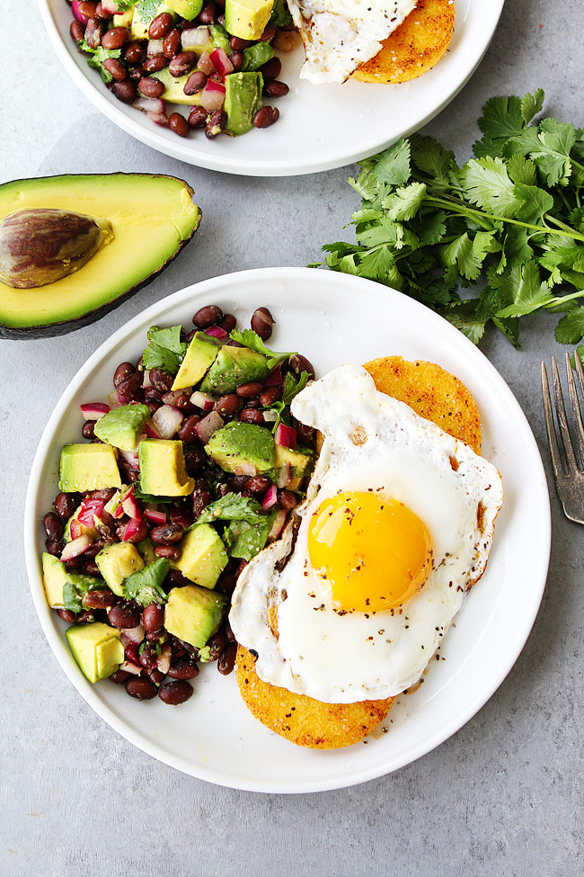 Breakfast for Dinner Ideas - Polenta Rounds with Fried Eggs and Avocado Bean Salsa via Two Peas and Their Pod | https://www.roseclearfield.com