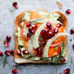 Fall and Winter Avocado Toast Recipes - Avocado Toast with Persimmon Pomegranate and Fennel via Floating Kitchen | https://www.roseclearfield.com