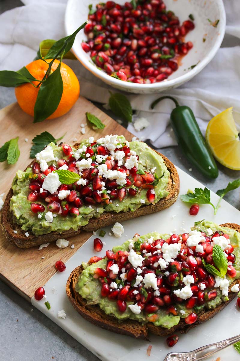 Fall and Winter Avocado Toast Recipes - Avocado Toast with Pomegranate Salsa and Goat Cheese via Dishing Out Health | https://www.roseclearfield.com