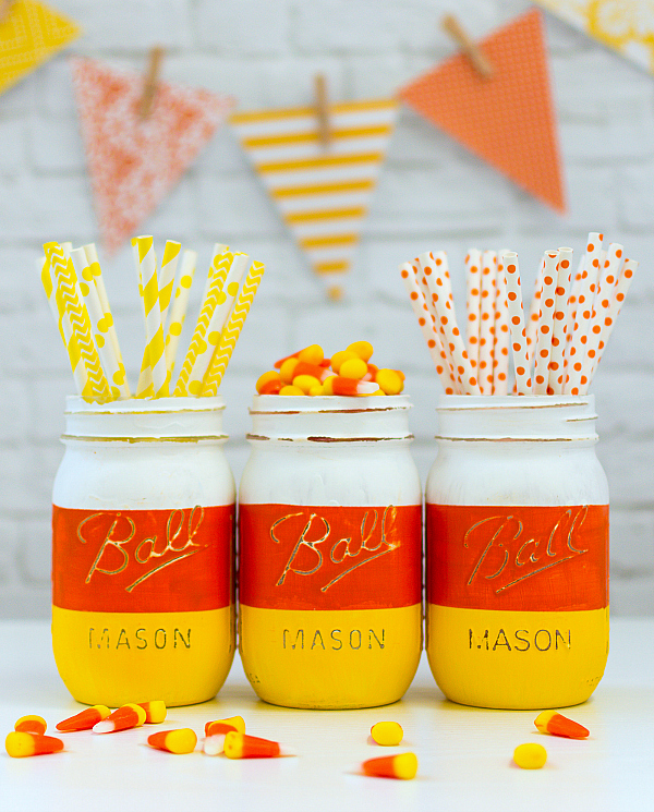 DIY Halloween Mason Jar Decor - Candy Corn Mason Jars for Halloween via Mason Jar Crafts Love | https://www.roseclearfield.com