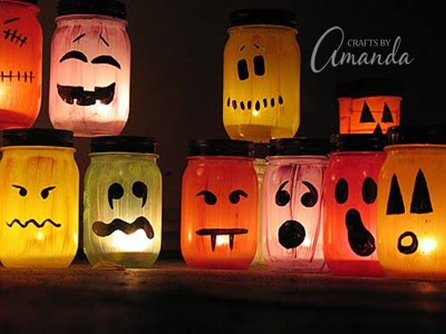 DIY Halloween Mason Jar Decor - Halloween Painted Luminaries via Crafts By Amanda | https://www.roseclearfield.com