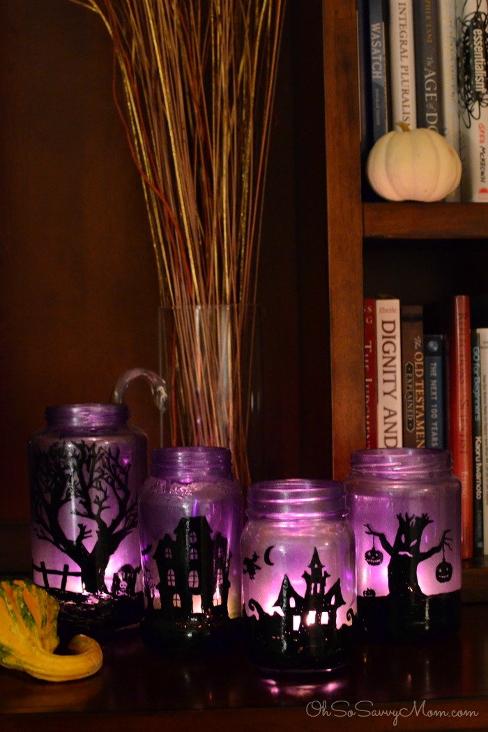 DIY Halloween Mason Jar Decor - Halloween Village Mason Jar Luminaries via Oh So Savvy Mom | https://www.roseclearfield.com