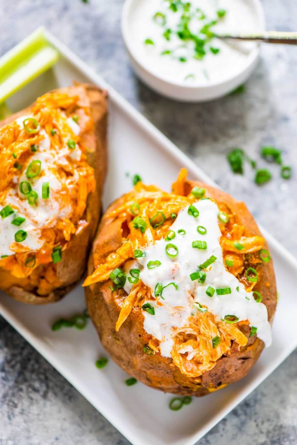 30 Days of Healthy Slow Cooker Dinner Recipes - Healthy Slow Cooker Buffalo Chicken Sweet Potatoes via Well Plated | https://www.roseclearfield.com