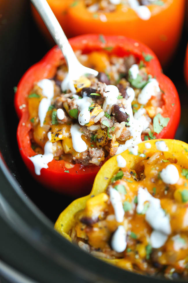 30 Days of Healthy Slow Cooker Dinner Recipes - Slow Cooker Stuffed Peppers via Damn Delicious | https://www.roseclearfield.com