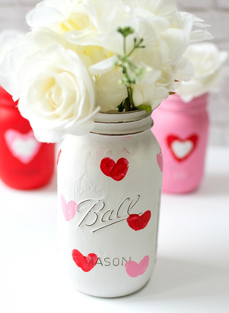 DIY Valentine's Day Mason Jar Decor - Valentine Kid Craft Thumbprint Heart Mason Jars via It All Started With Paint | https://www.roseclearfield.com