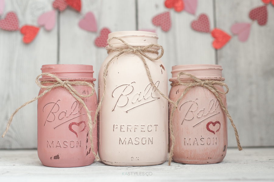 DIY Valentine's Day Mason Jar Decor - Valentine's Day Latex Painted Distressed Pastel Mason Jars via KA Styles | https://www.roseclearfield.com