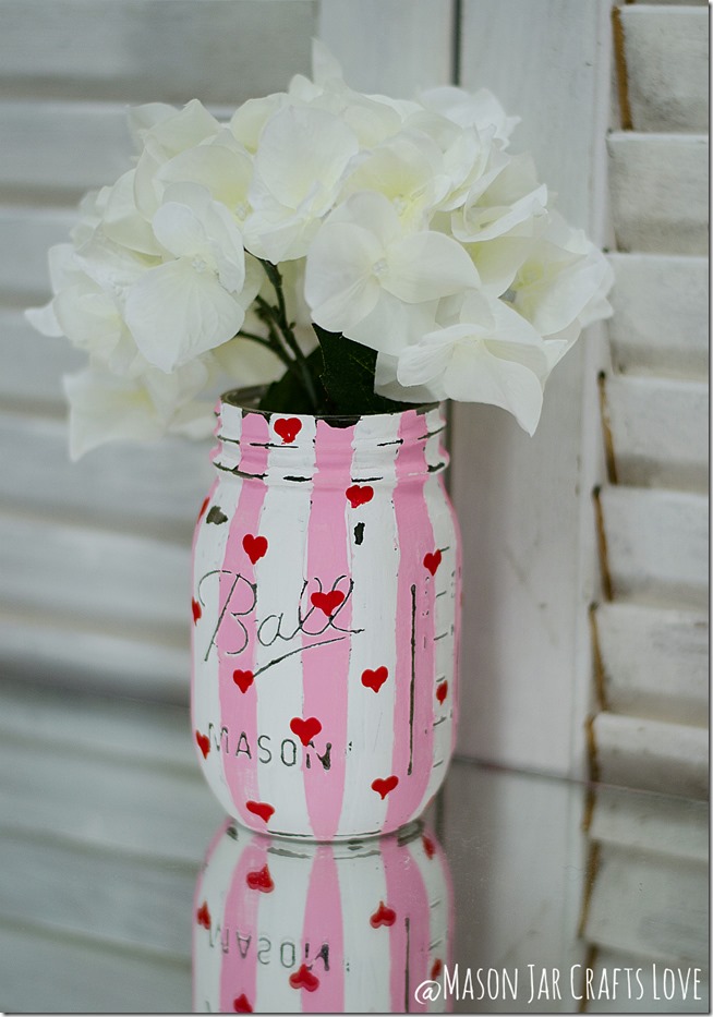 DIY Valentine's Day Mason Jar Decor - Valentine's Day Striped Heart Distressed Mason Jars via Mason Jar Crafts Love | https://www.roseclearfield.com