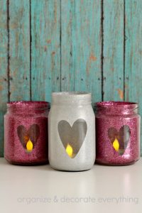 DIY Valentine's Day Mason Jar Decor - Glitter Heart Valentine's Day Mason Jars via Organize Your Stuff Now | https://www.roseclearfield.com