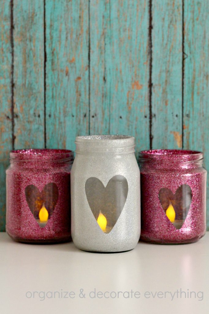 DIY Valentine's Day Mason Jar Decor - Glitter Heart Valentine's Day Mason Jars via Organize Your Stuff Now | https://www.roseclearfield.com