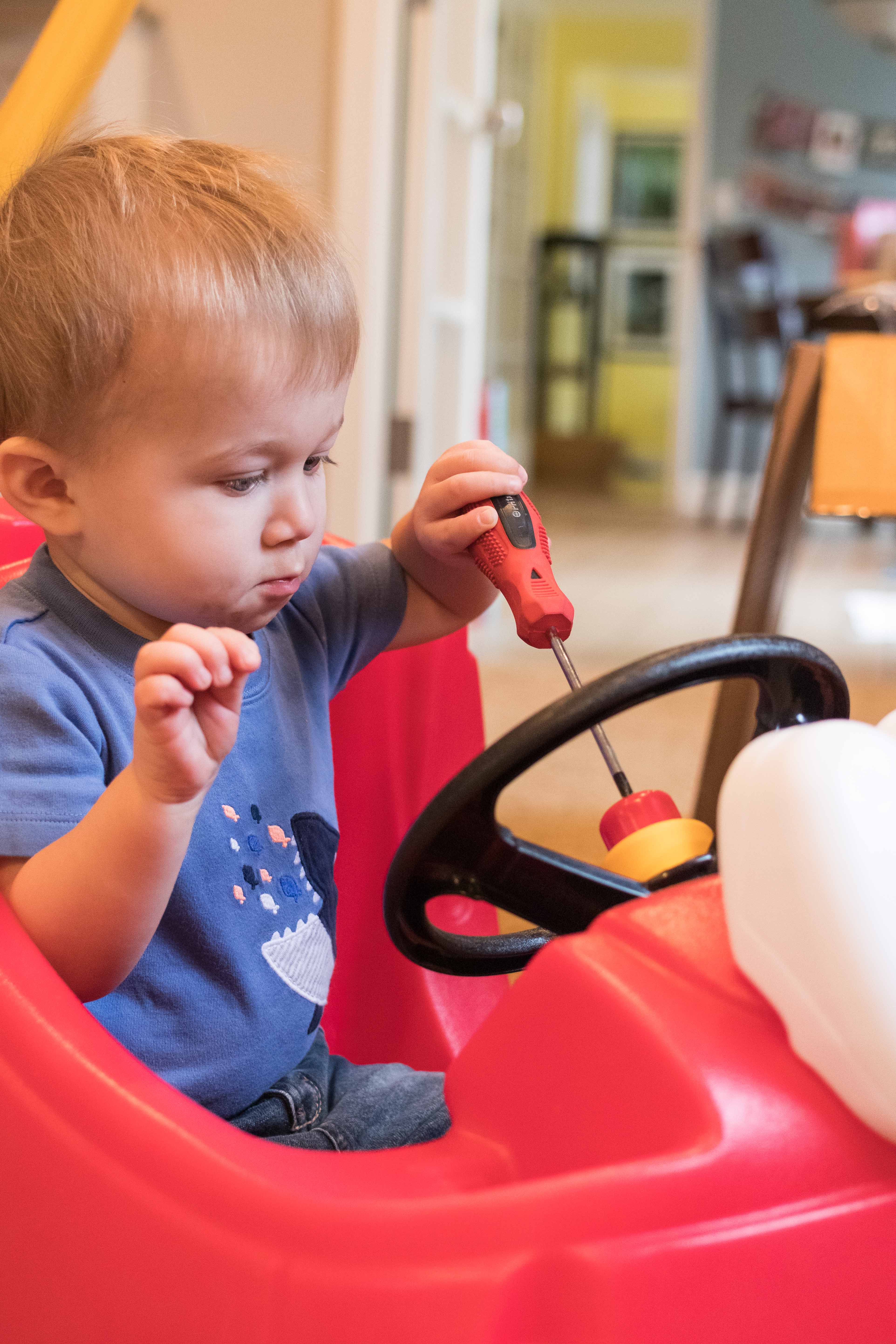 Tommy Working on the Cozy Coupe | https://www.roseclearfield.com