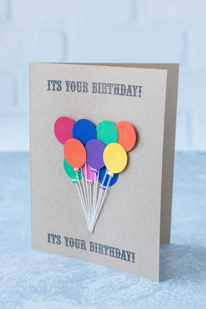 Classic birthday balloon bouquet on a handmade birthday card. Adhesive mounting squares pop the middle and top rows of the bouquet. #balloonbouquet #birthdaygreeting #birthdaycardidea | https://www.roseclearfield.com