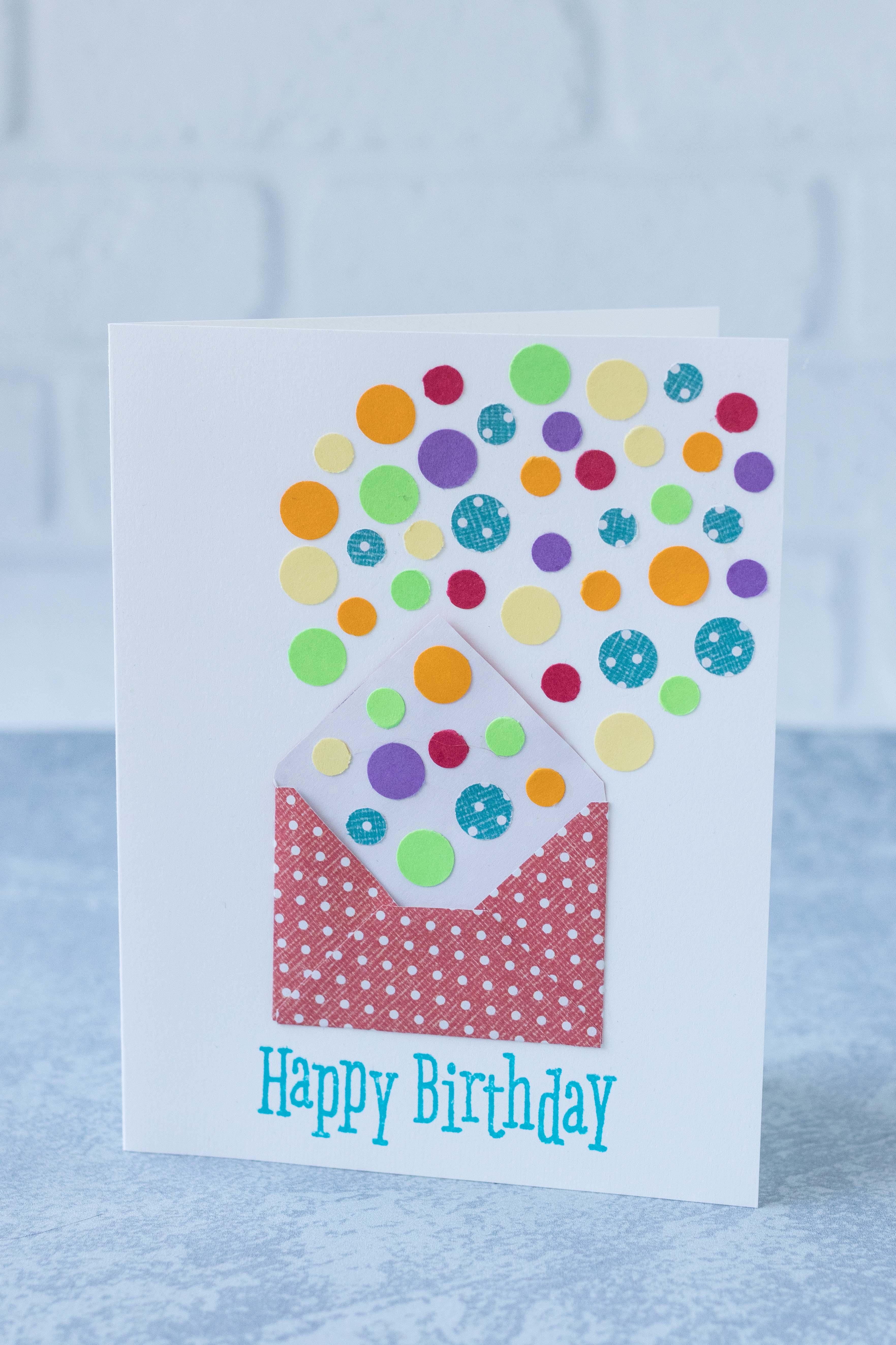 DIY birthday card with confetti circles spilling out of a tiny red and white polka dot envelope. #birthdaycard #birthdayconfetti #DIYgreetingcard | https://www.roseclearfield.com