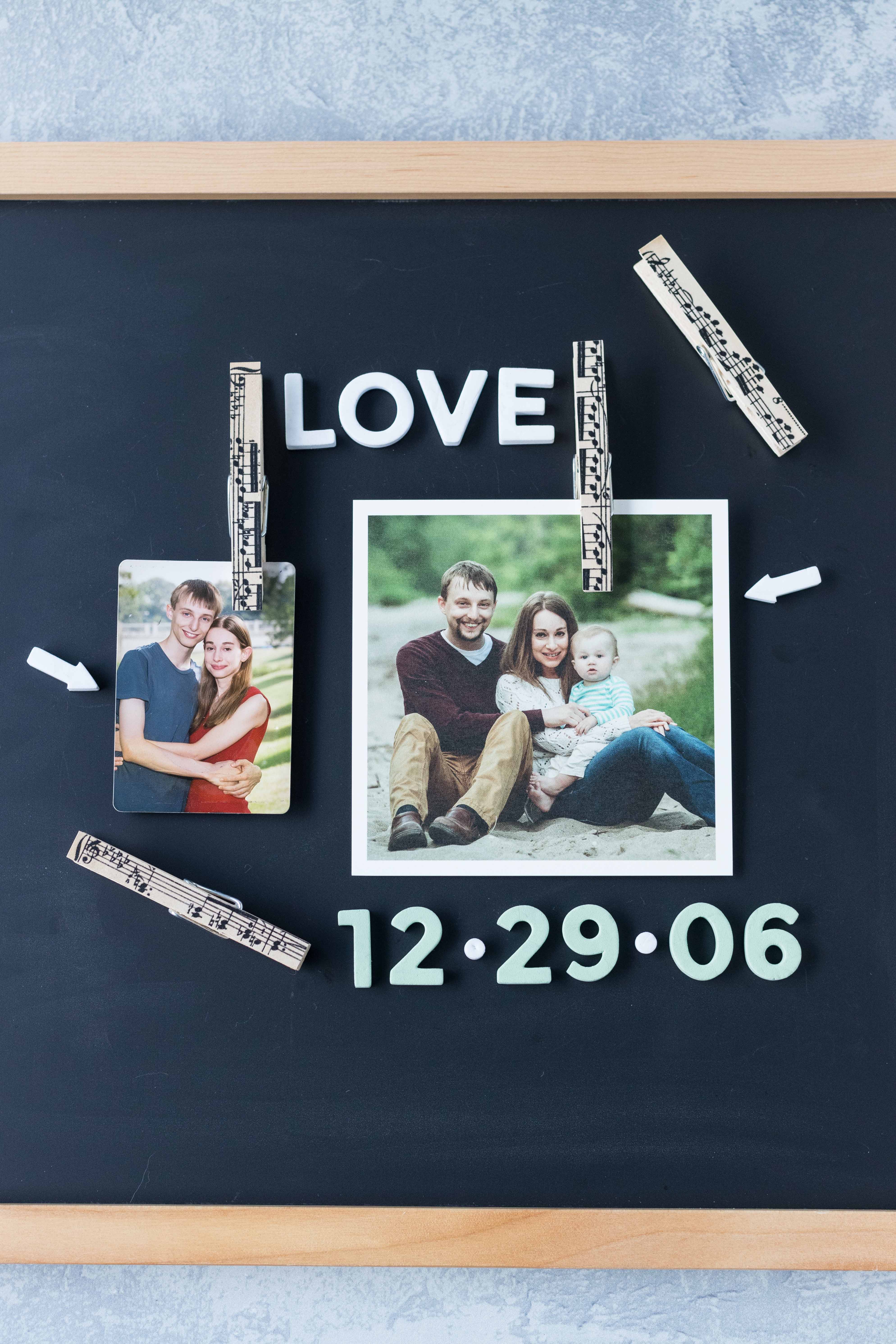 Chalkboard photo display with DIY antique sheet music clothespin magnets. Such a simple, fun way to personalize a message board! #DIY #clothespins #sheetmusic | https://www.roseclearfield.com