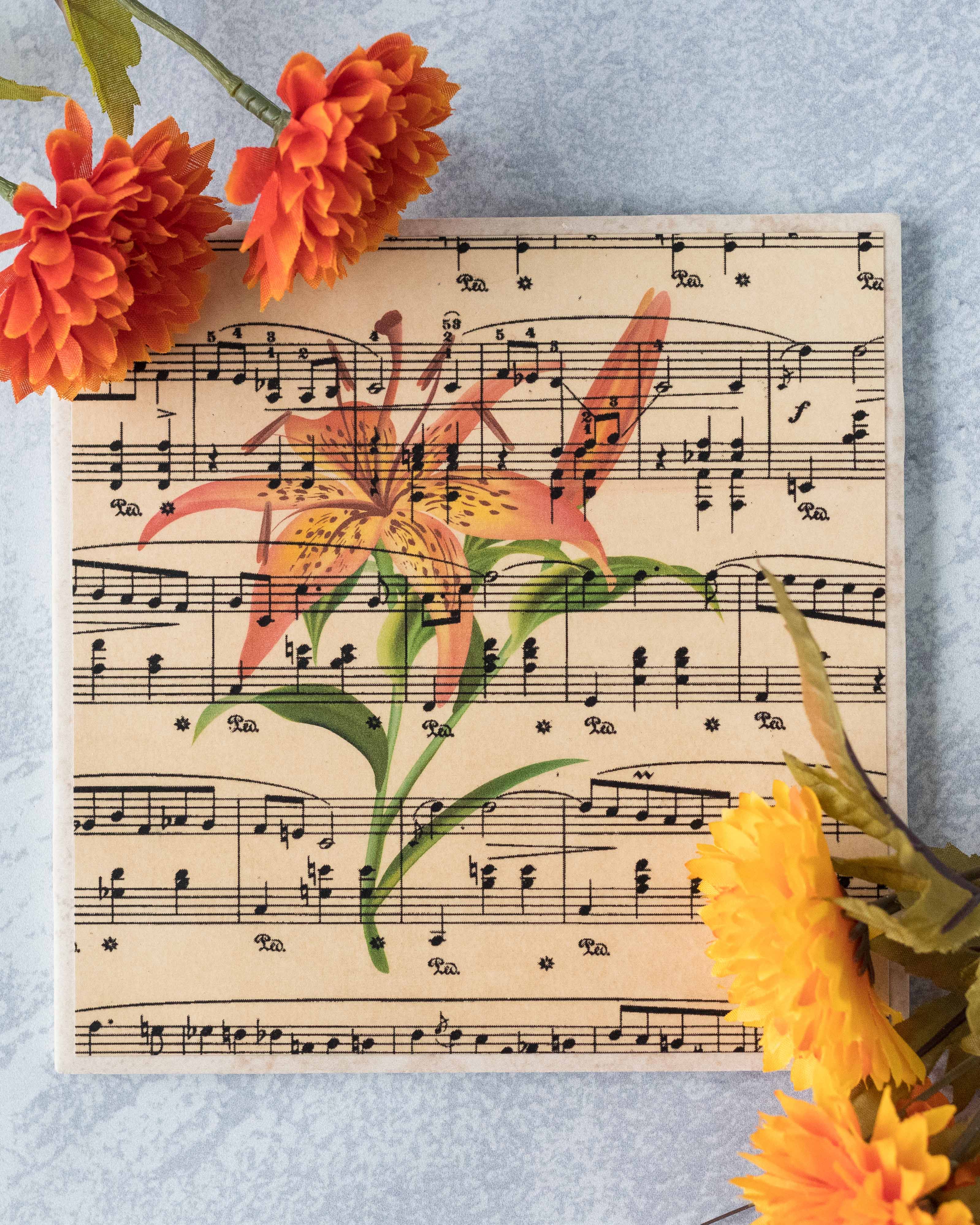 DIY antique sheet music tile with tiger lily. Such a simple, beautiful piece of handmade home decor! #DIY #sheetmusic #tigerlily | https://www.roseclearfield.com