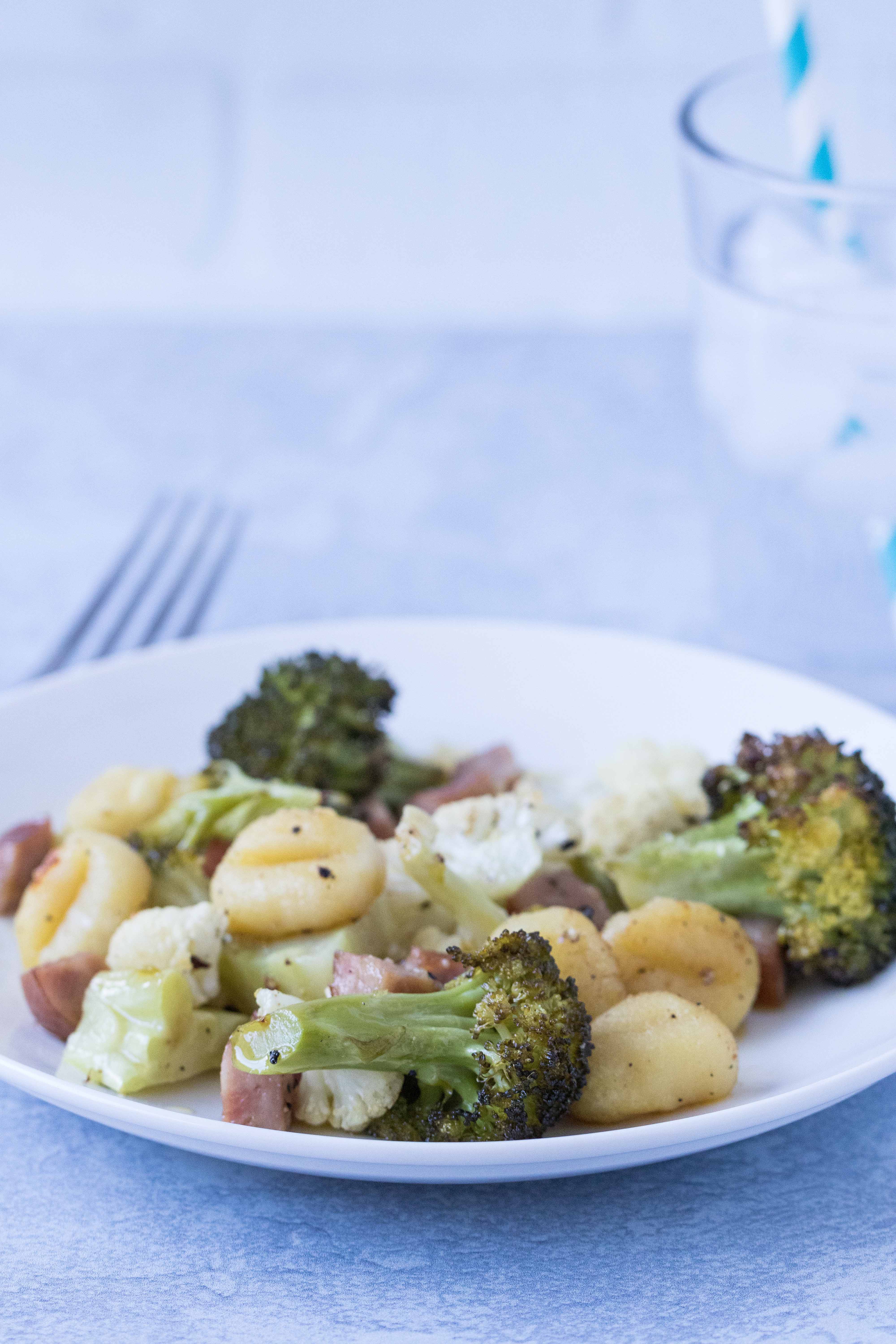 Quick, family-friendly dinner idea: sheet pan gnocchi with chicken sausage and veggies. #sheetpandinner #kidfriendly #30minutemeal | https://www.roseclearfield.com