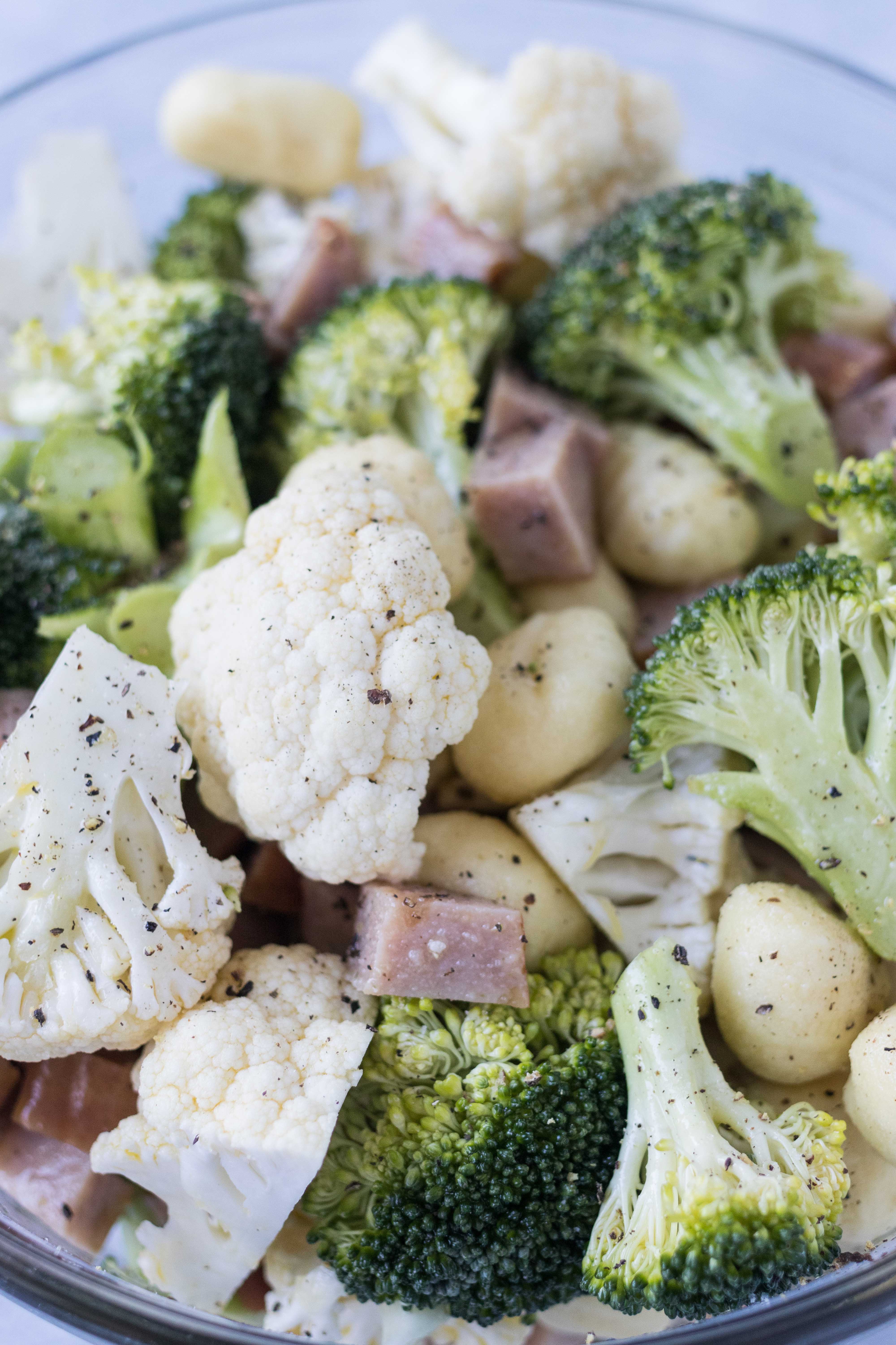 Ready to make sheet pan gnocchi with chicken sausage, broccoli, and cauliflower! A healthy, family-friendly meal. #weeknightdinner #sheetpanmeal #healthyeating | https://www.roseclearfield.com