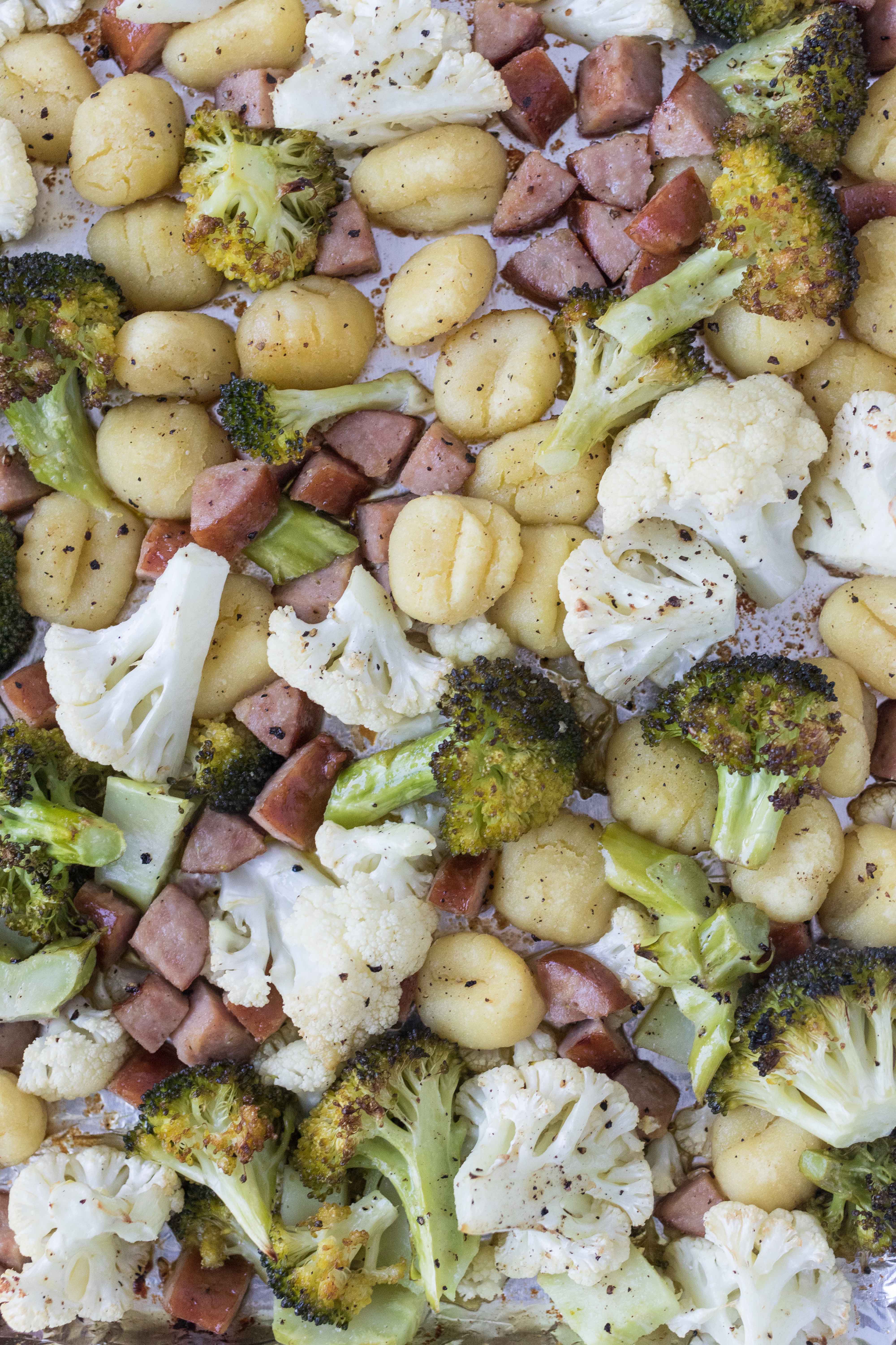 30-minute, family-friendly sheet pan meal: roasted gnocchi, chicken sausage, broccoli, and cauliflower #30minutemeal #healthydinner #weeknightcooking | https://www.roseclearfield.com