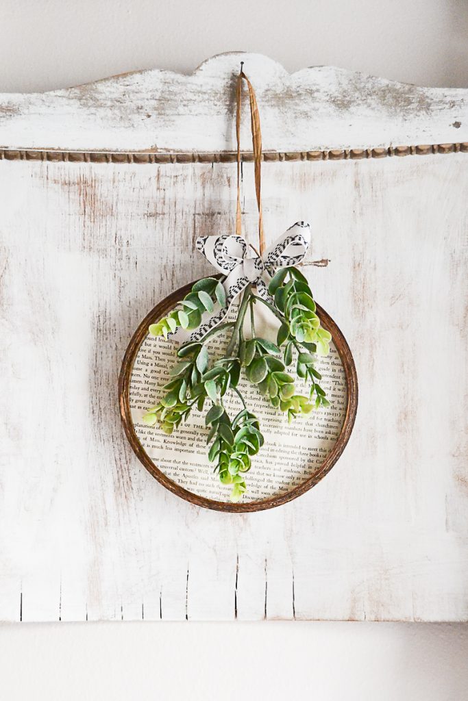 Spring embroidery hoop wreath decor: spring wreath made from embroidery hoop and book pages via My Creative Days | https://www.roseclearfield.com