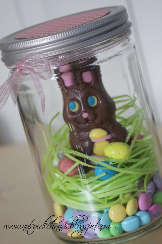 Easter grass and candies nest for a chocolate bunny. Too cute! via Not So Idle Hands #Easter #chocolatebunny #masonjars | https://www.roseclearfield.com