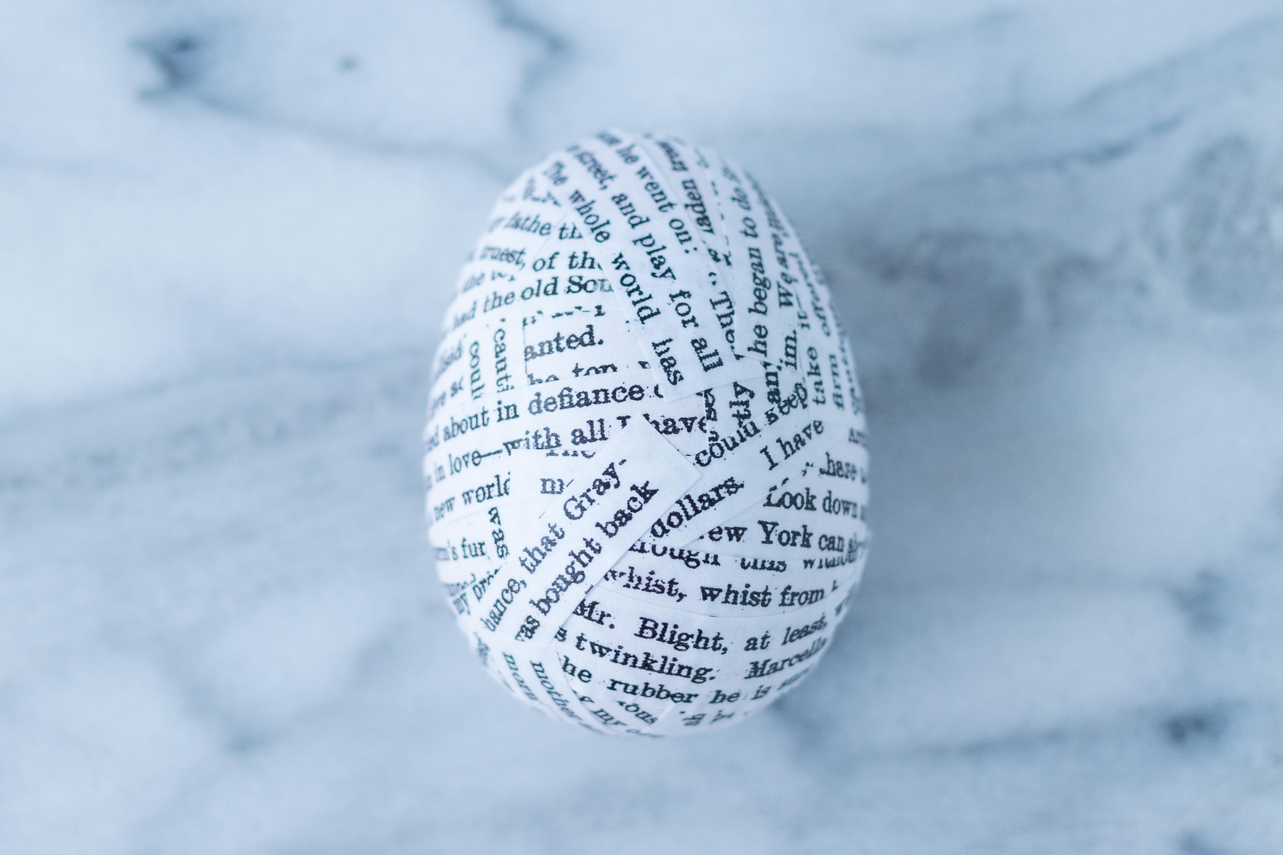 DIY Book Page Plastic Easter Eggs. A whimsical, upcycled Easter decorating idea that's fun for the whole family! #Easter #DIY #bookpagecrafts | https://www.roseclearfield.com