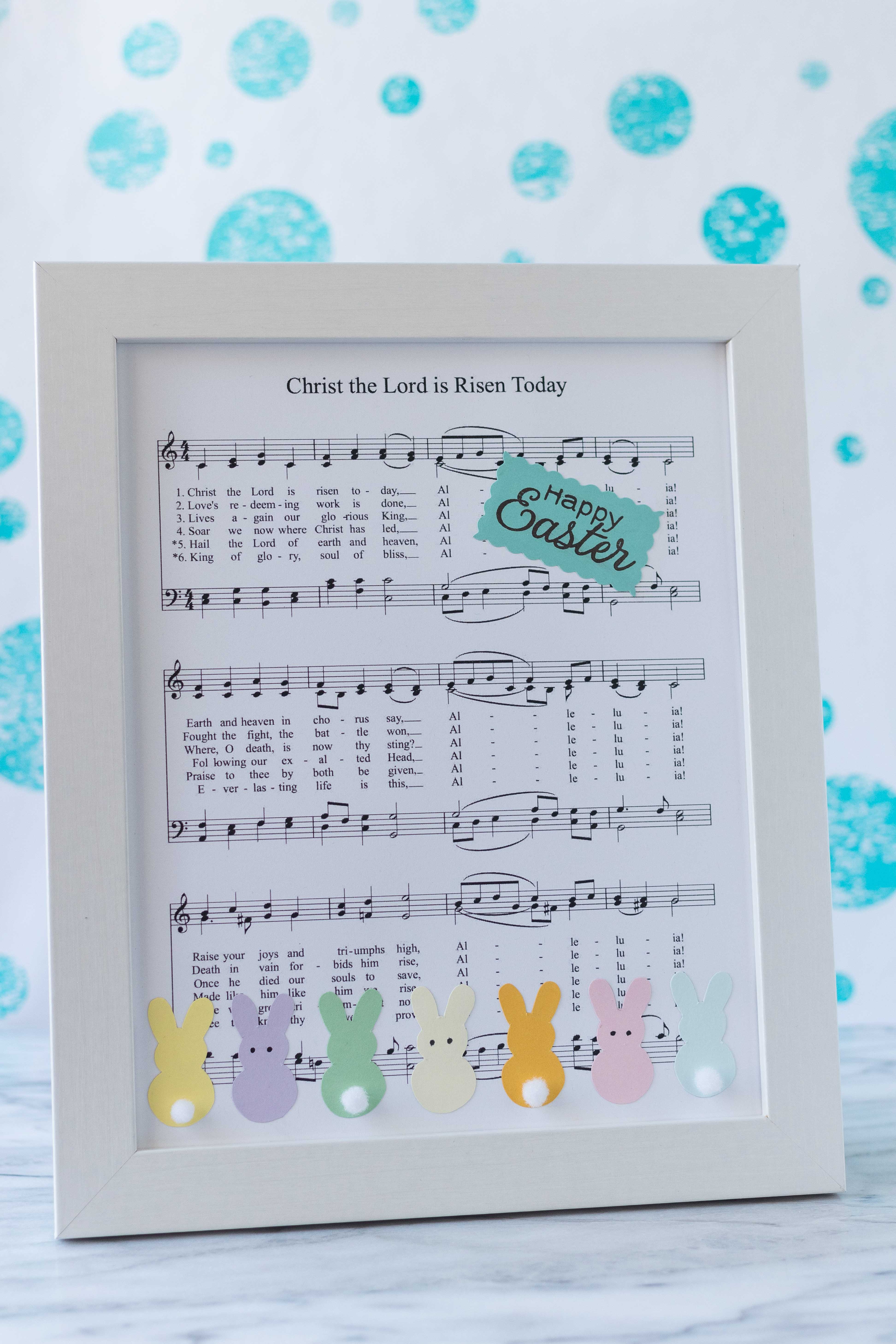 DIY Easter sheet music wall decor ready to display in an entryway, living room, or kitchen! | https://www.roseclearfield.com