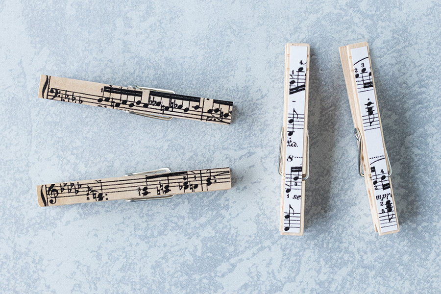 When you make DIY sheet music clothespin magnets, you can cut horizontal or vertical strips. #DIY #sheetmusic #clothespins | https://www.roseclearfield.com