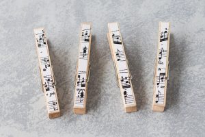 DIY sheet music clothespin magnets. Perfect easy home decor project to make with kids or to give as a gift to a favorite music teacher! #giftidea #sheetmusic #DIYclothespins | https://www.roseclearfield.com