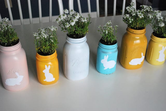 Colorful mason jar planters serve as cheerful Easter decor. #DIYplanters #bunnies #Easter | https://www.roseclearfield.com