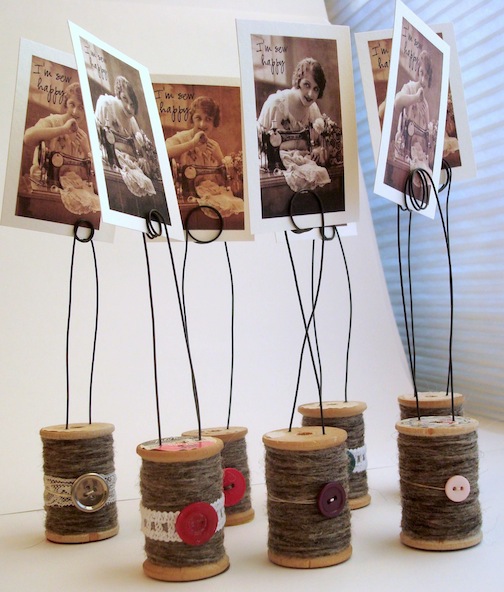 Photo holders made of upcycled wooden spoons, twine, and buttons. So whimsical! via Believe Magic #upcycled #woodenspools #photoholders | https://www.roseclearfield.com