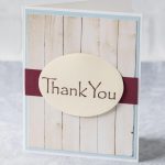 Simple DIY thank you card with a faux wood background and deep red strip behind a mounted oval "thank you." #thankyoucard #homemadecard #greetingcardinspiration | https://www.roseclearfield.com