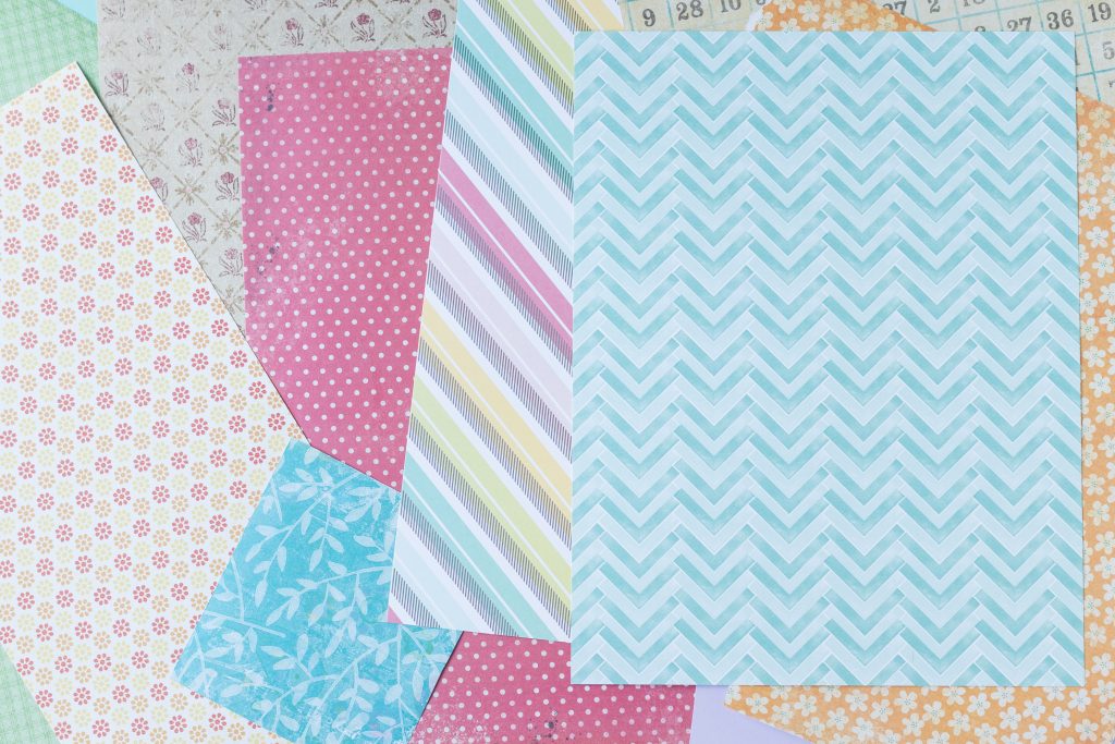 Card stock and scrapbook paper to make DIY scrapbook embellishments. #cardstock #scrapbookpaper #DIYscrapbookembellishments | https://www.roseclearfield.com