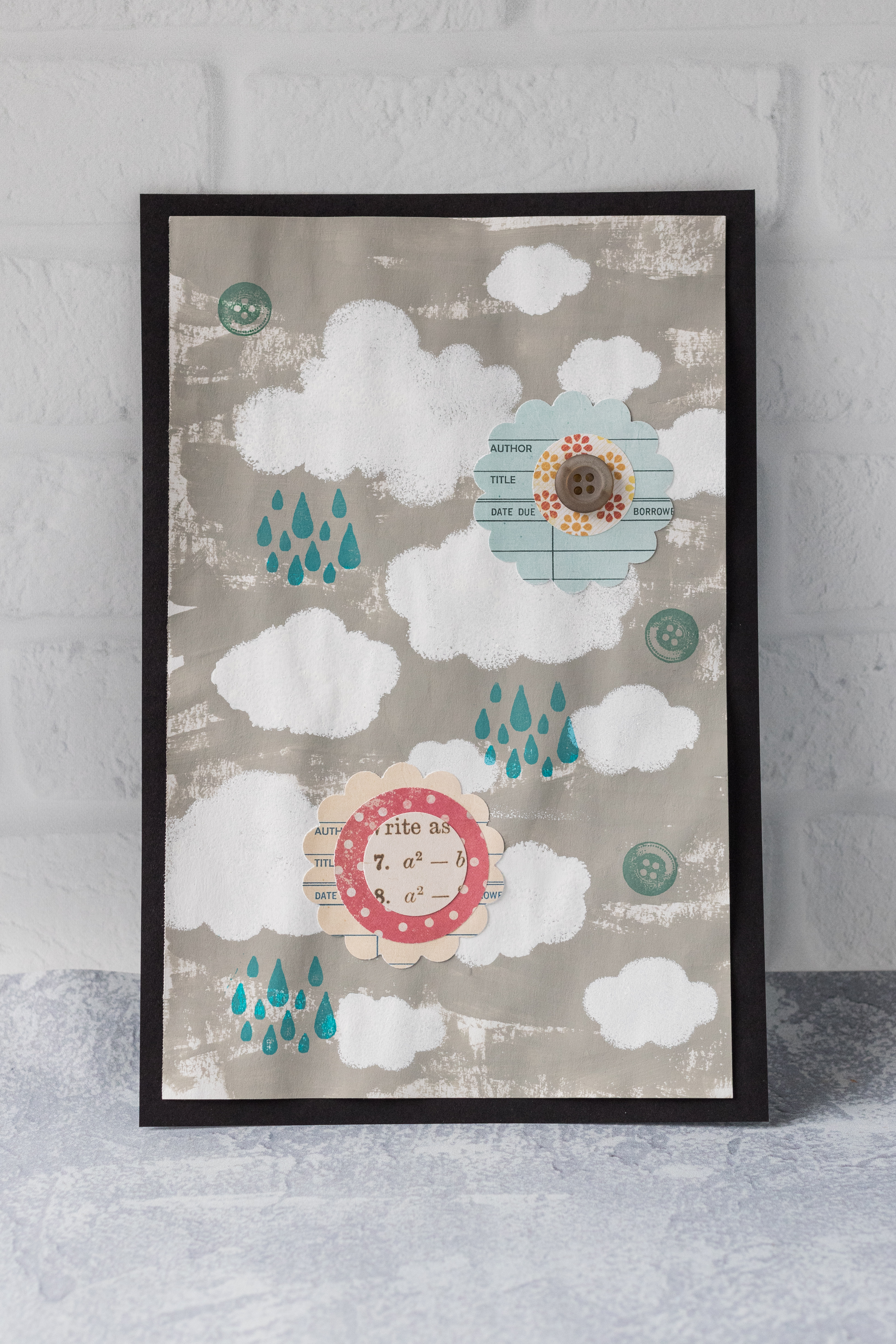 Mixed media cloud art featuring acrylic paint, stamps, and DIY scrapbook embellishments. #mixedmedia #DIY #clouds #scrapbookembellishments | https://www.roseclearfield.com