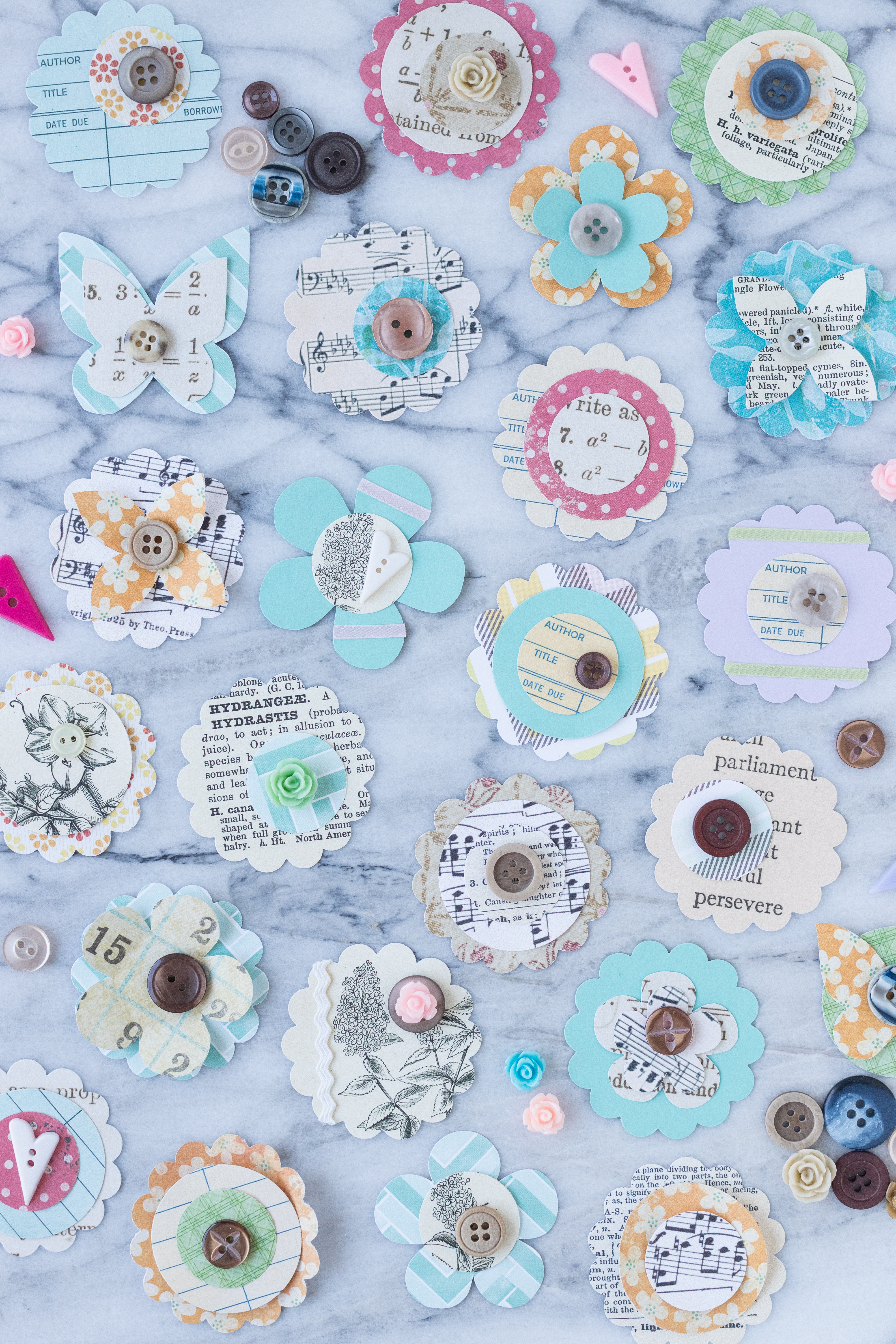 Experiment with different configurations for DIY scrapbook embellishments before gluing or sewing them together. #DIY #handmade #scrapbookembellishments | https://www.roseclearfield.com