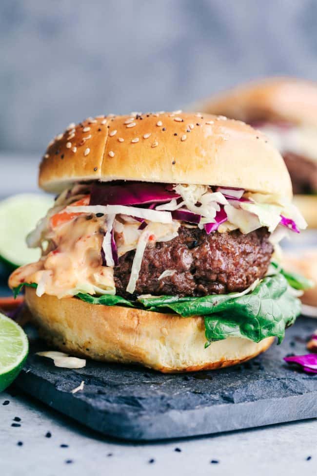 Asian barbecue burgers topped with sweet chili lime mayo. Amazing flavor pairing! #Asianburgers #sweetchilimayo #grillingrecipe | https://www.roseclearfield.com