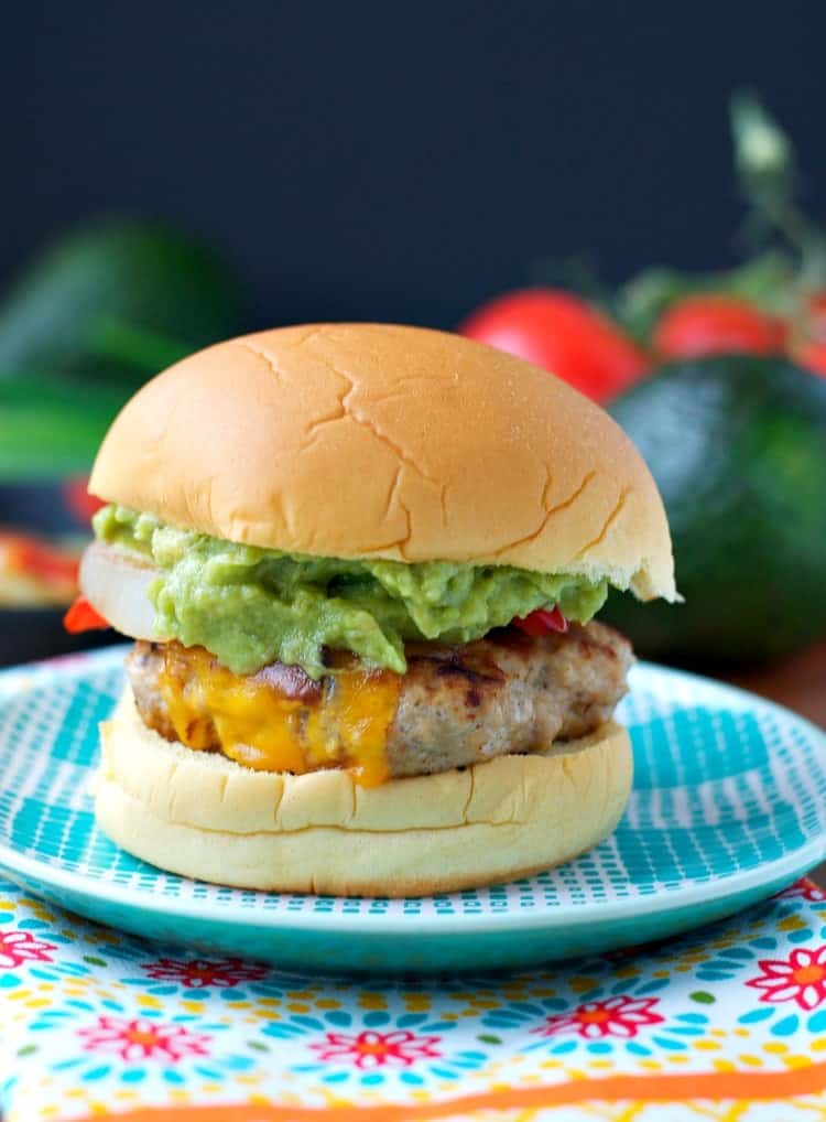 Chicken fajita burgers via The Seasoned Mom. All of the flavors of fajitas in a chicken burger! #chickenburger #fajitaburger #grillingrecipe | https://www.roseclearfield.com