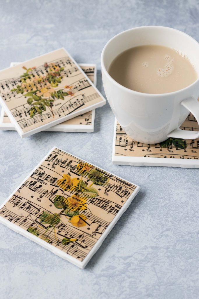 DIY vintage sheet music botanical tile coasters. Beautiful drink coasters or home decor! #DIY #vintagesheetmusic #botanicalcoasters | https://www.roseclearfield.com