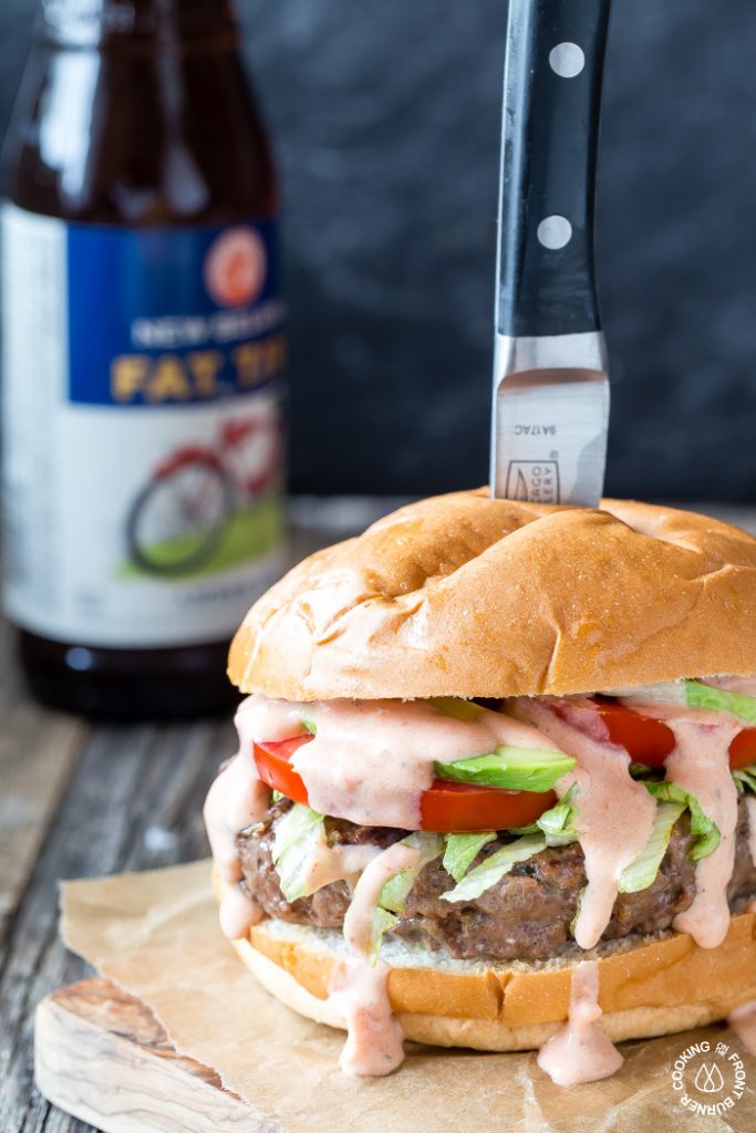 Loaded taco burger topped with cheese, avocado, and Mexican salsa via Cooking on the Front Burners. Amazing flavors! #tacoburger #Mexicansalsa #grilling | https://www.roseclearfield.com