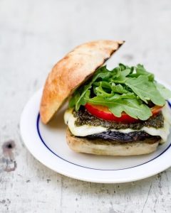 Pesto portobello mushroom burger via A Couple Cooks. Delicious vegetarian burger with so much flavor! #portobelloburger #portobellomushroom #pesto | https://www.roseclearfield.com