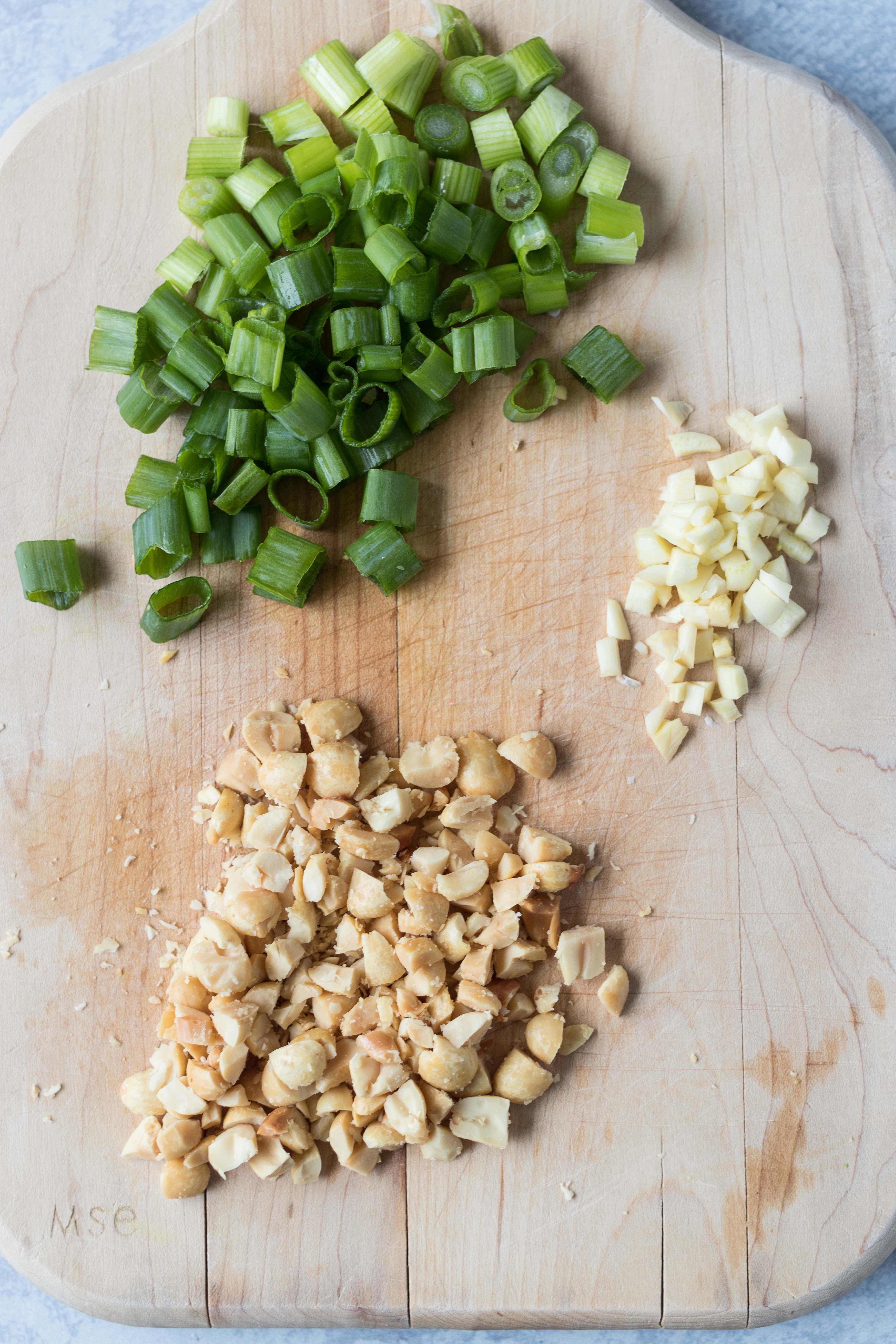 Chopped green onion, peanuts, and garlic for peanut sesame Ramen. Quick, healthy lunch dish! #healthylunchidea #sesameRamen #peanutnoodles | https://www.roseclearfield.com